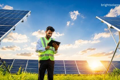 Solar panel price Delhi with technician inspecting commercial solar panels for cost-effective clean energy.