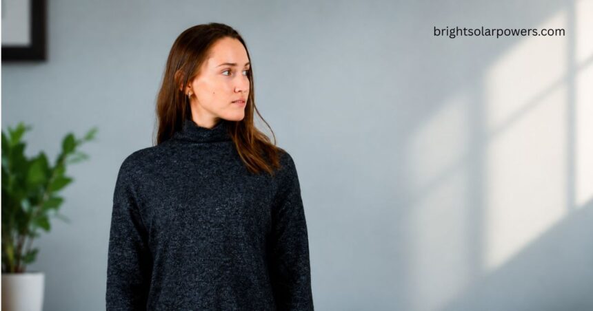 Woman wearing a stylish high neck sweater.