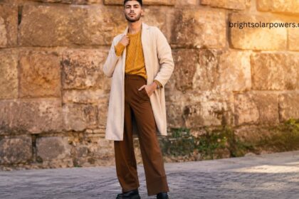 Stylish afghani trousers paired with a modern sweater and overcoat, showcasing a trendy ethnic fashion look for men.