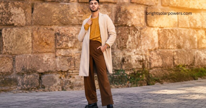 Stylish afghani trousers paired with a modern sweater and overcoat, showcasing a trendy ethnic fashion look for men.